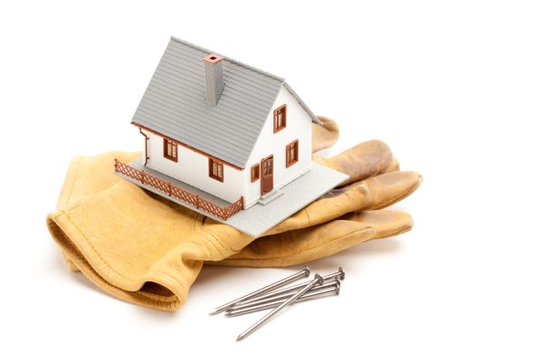 House, Gloves and Nails Isolated on a White Background.